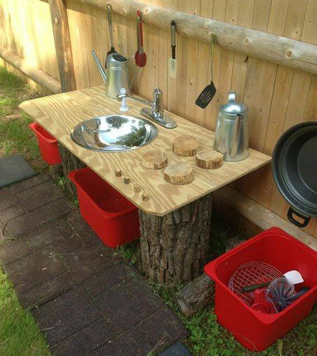 Basic Mud Kitchen made from tree stumps